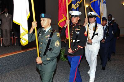 Joint service color guard ceremony with Army Marine and Navy flags