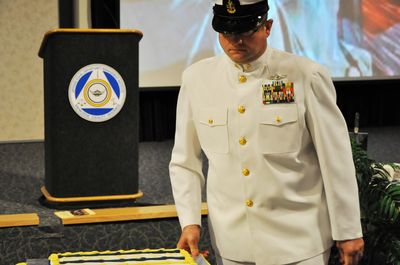Formal ceremony with color guard and flags