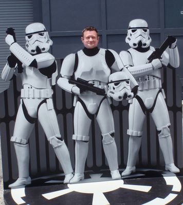Don Sawyer posing with Star Wars stormtrooper characters