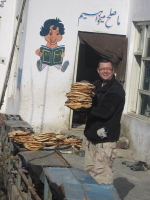 Sharing a meal with locals during an overseas deployment