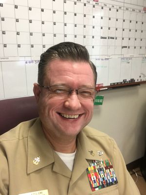 At the office, tan service uniform with ribbons