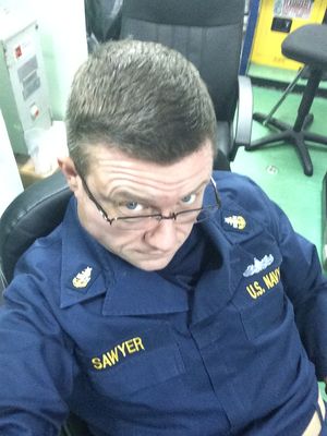 At my desk, name tape reading Sawyer, U.S. Navy