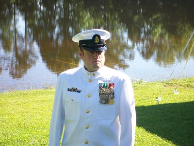 Formal portrait in dress whites near the water