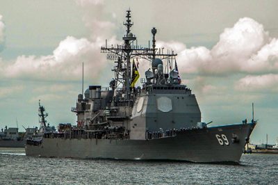 USS Vicksburg crew manning the rails in dress blues