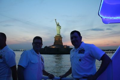 Sailors with the Statue of Liberty in the background during Fleet Week, New York City