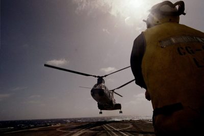 Aviation operations underway off the stern of the ship